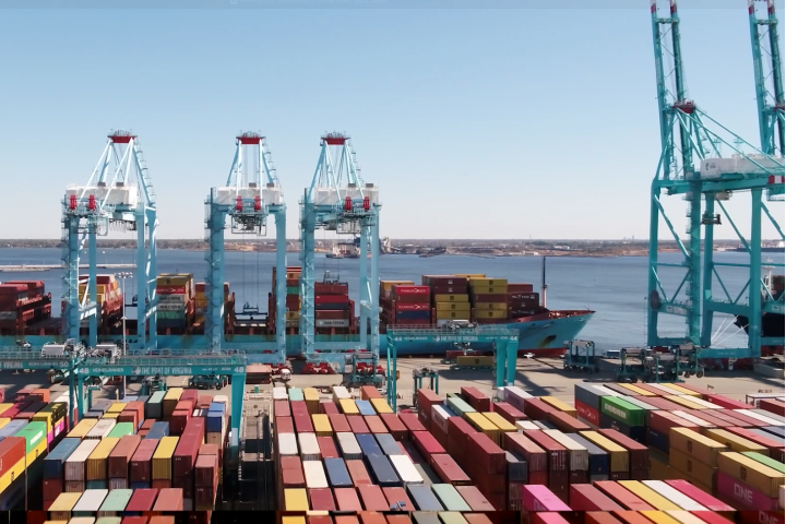 Container ships, cranes and stacked cargo containers at the Port of Virginia.