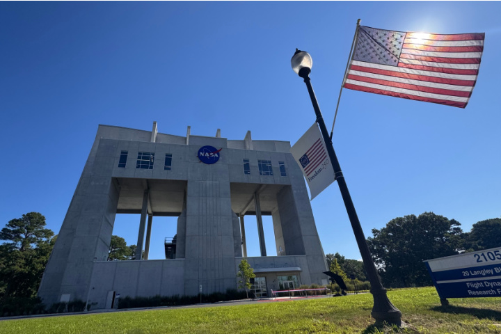 The Flight Dynamics Research Facility at NASA Langley Research Center in Hampton, Virginia, with an American flag flying in the foreground.