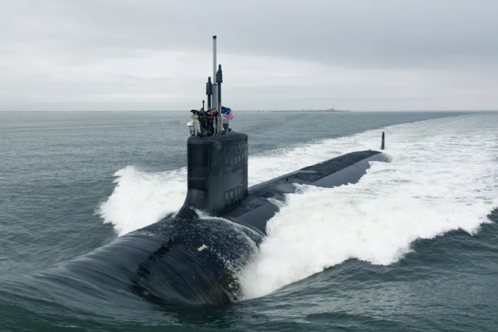 U.S. Navy nuclear powered submarine underway at sea, representing the $76.6 billion Navy contract supporting submarine construction and shipbuilding.